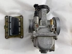 Modified Honda CR125 1995 Carburator And Reed 16100-KZ4-620 Used. Price: $150.00.